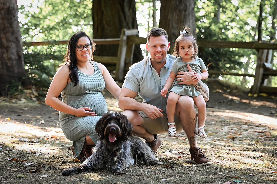 sporting dog with family in background